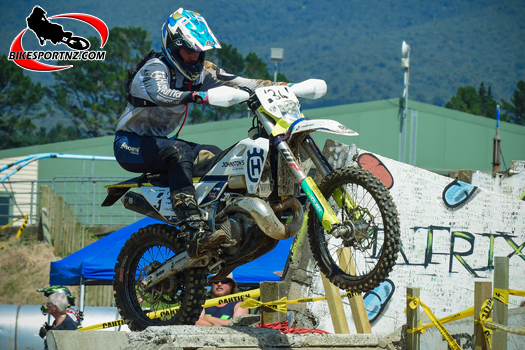 Taranaki’s Sam Parker (Husqvarna TE300), in sublime form on the tricky course near Egmont Village on Sunday. Photo by Andy McGechan, BikesportNZ.com