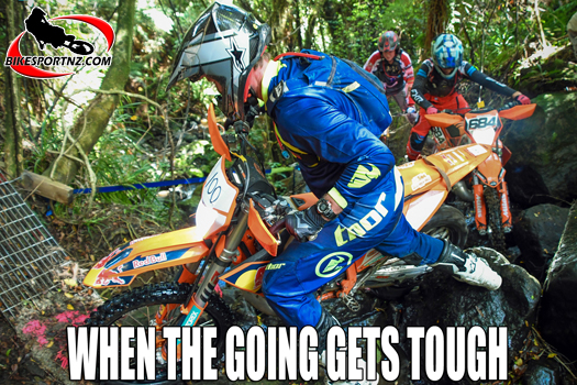Cameras do lie … the image captured here does not do justice to the steep, slippery wet rock terrain that these riders are attempting to conquer. Photo by Andy McGechan, BikesportNZ.com